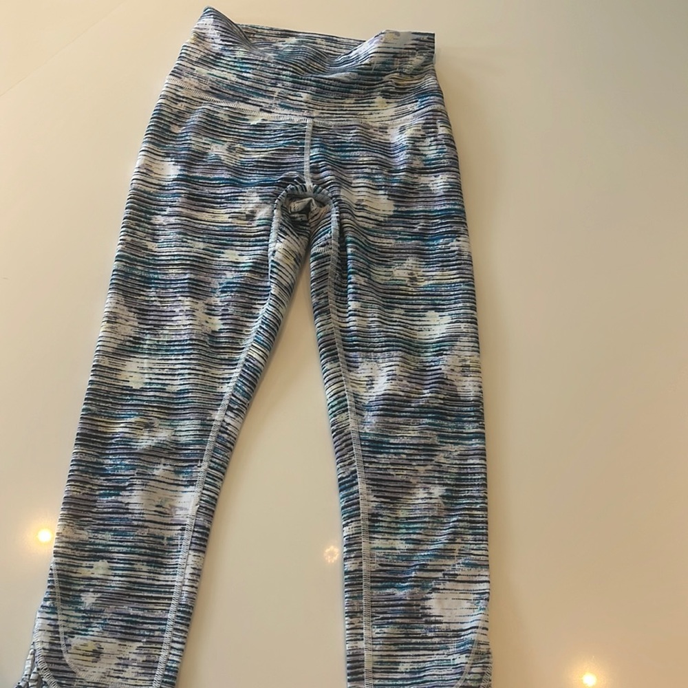 Lulu lemon tights with cut out detail in back of lower leg - calf length.